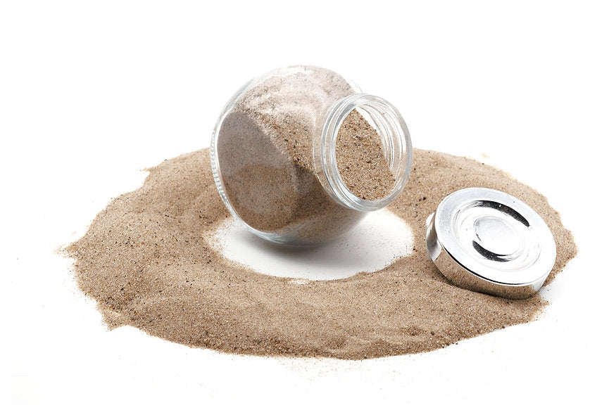 A jar filled with reptile sand