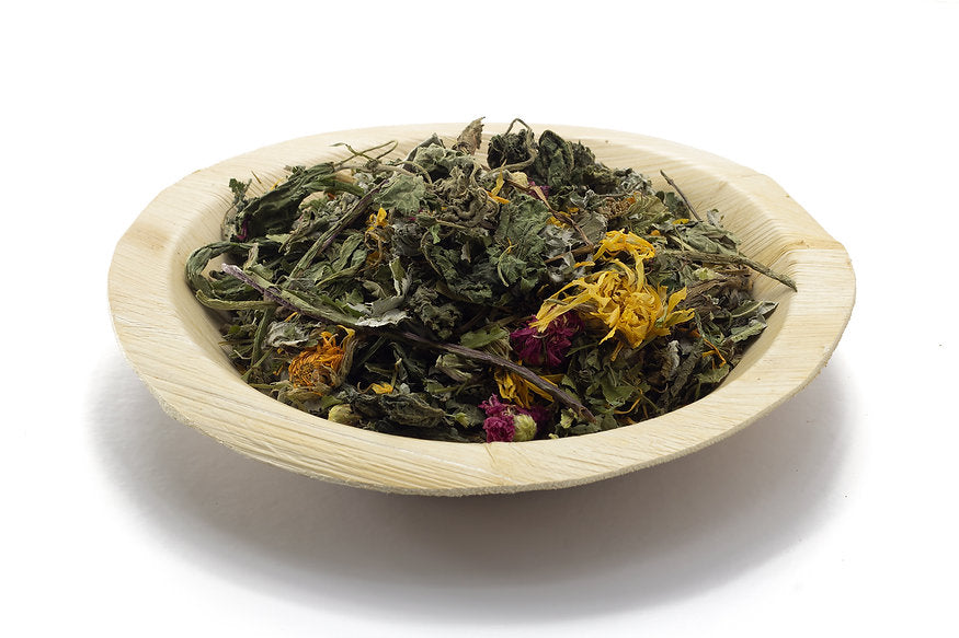 A palm bowl filled with Herb Salad Mix