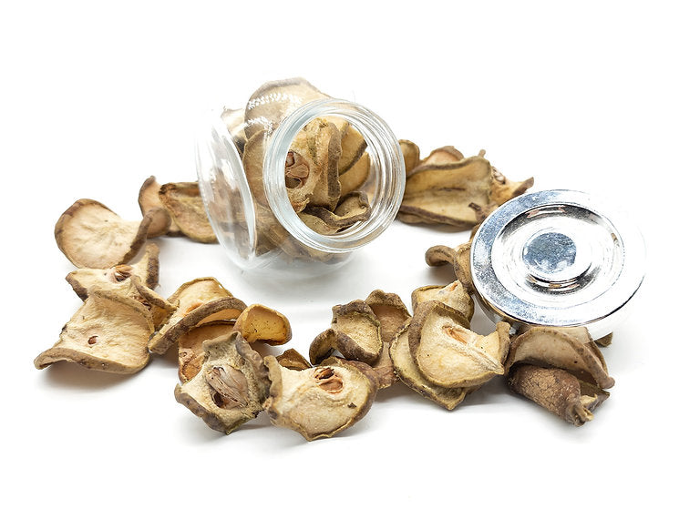A jar filled with pear slices