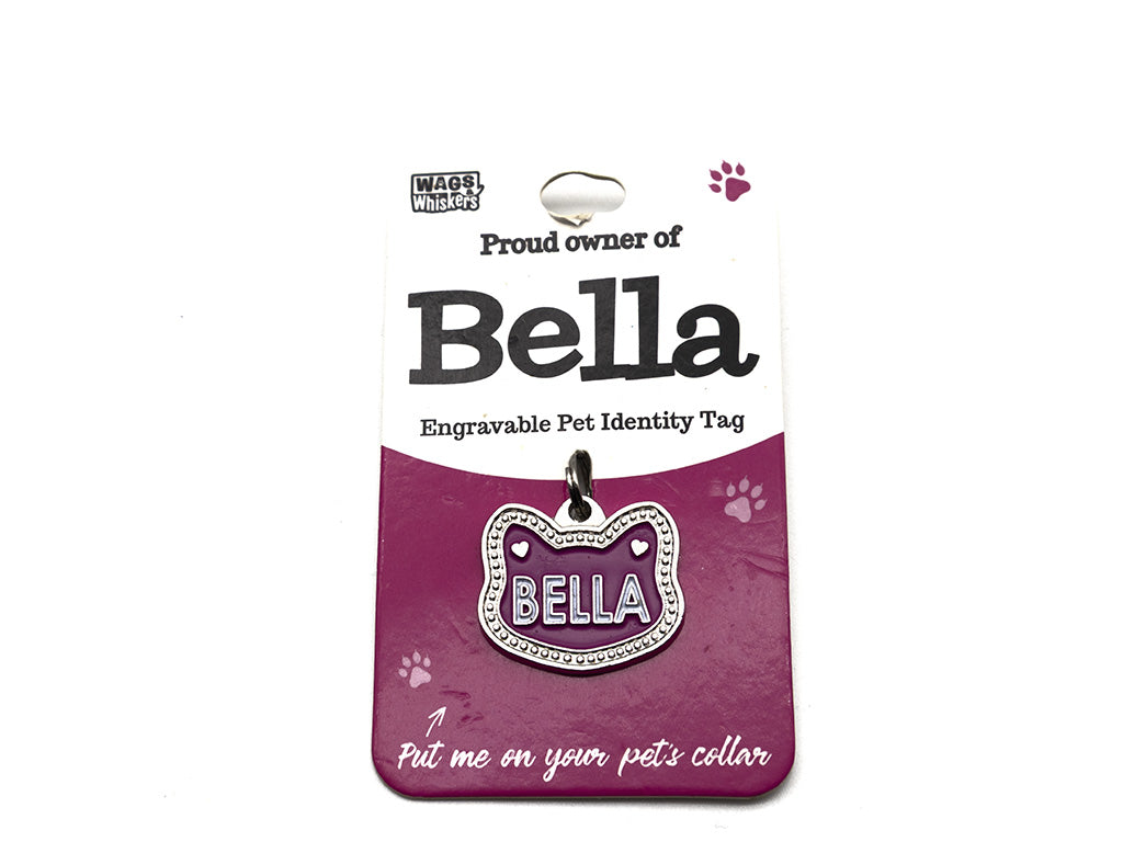 Engravable pet identity tag for Bella on a purple card with Wag Whistle branding.