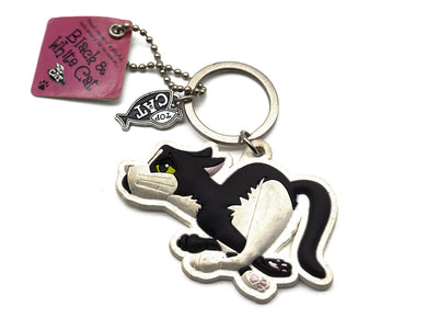 Cat-shaped keychain with a fish, attached to a pink tag and chain, on a white background.
