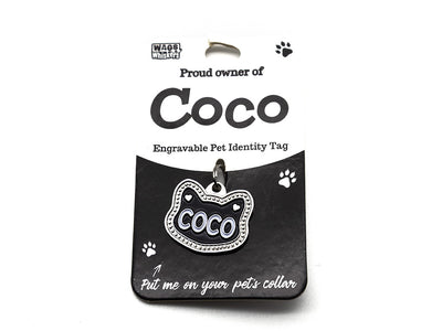 Engravable pet identity tag for Coco on a black background