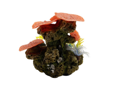 Decorative aquarium rock formation with coral-like structures on a white background