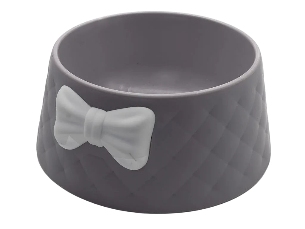 Gray pet bowl with a bow design on a white background