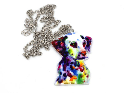 Colorful dog-shaped pendant on a silver chain against a white background