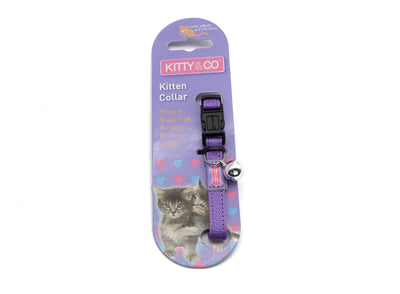 Kitty Co Kitten Collar in purple with a black plastic buckle and a small silver bell, packaged on a purple cardboard backing featuring a kitten photo.