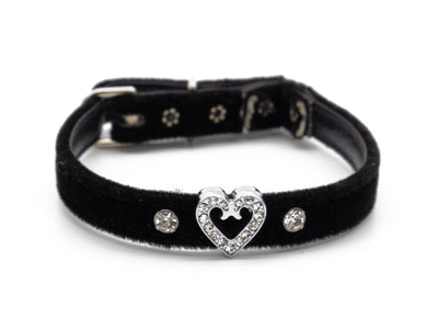 A black velvet collar with a silver-tone heart-shaped clasp adorned with clear rhinestones, flanked by two matching rhinestone studs on a white background.