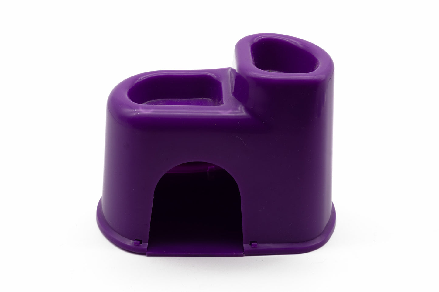 A small purple plastic accessory with a rounded rectangular shape, featuring a top opening and a lower arched opening, photographed on a plain white background.