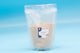 500g resealable pouch of small animal bathing sand on blue background