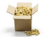 A large cardboard box filled with monkey nuts, with several nuts visible spilling out of the open box.