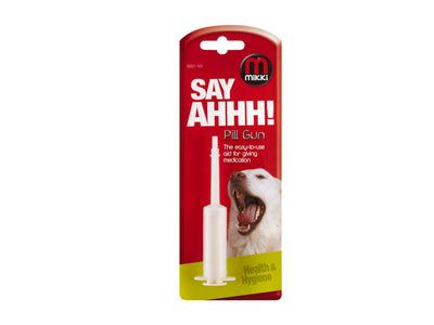 Micki Say AHHH! Pill Gun pet medication dispenser in its original red and yellow blister card packaging, featuring a picture of a happy dog.