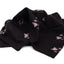 Black fabric with white abstract patterns on a white background