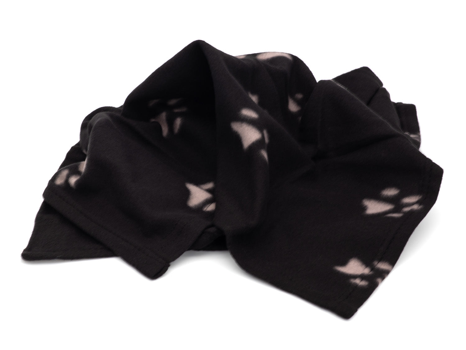 Black fabric with white abstract patterns on a white background