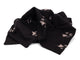 Black fabric with white abstract patterns on a white background