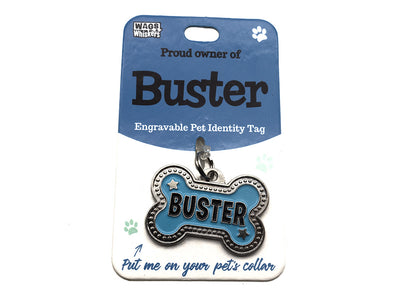Engravable pet identity tag for a dog named 'Buster' on a blue card with 'Wags & Whiskers' branding.