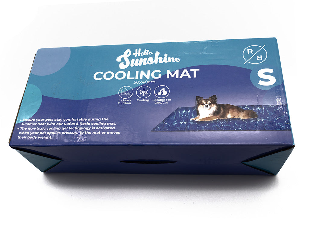 Box of Hello Sunshine cooling mat with a dog lying on it