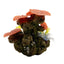 Decorative aquarium rock formation with coral-like structures on a white background