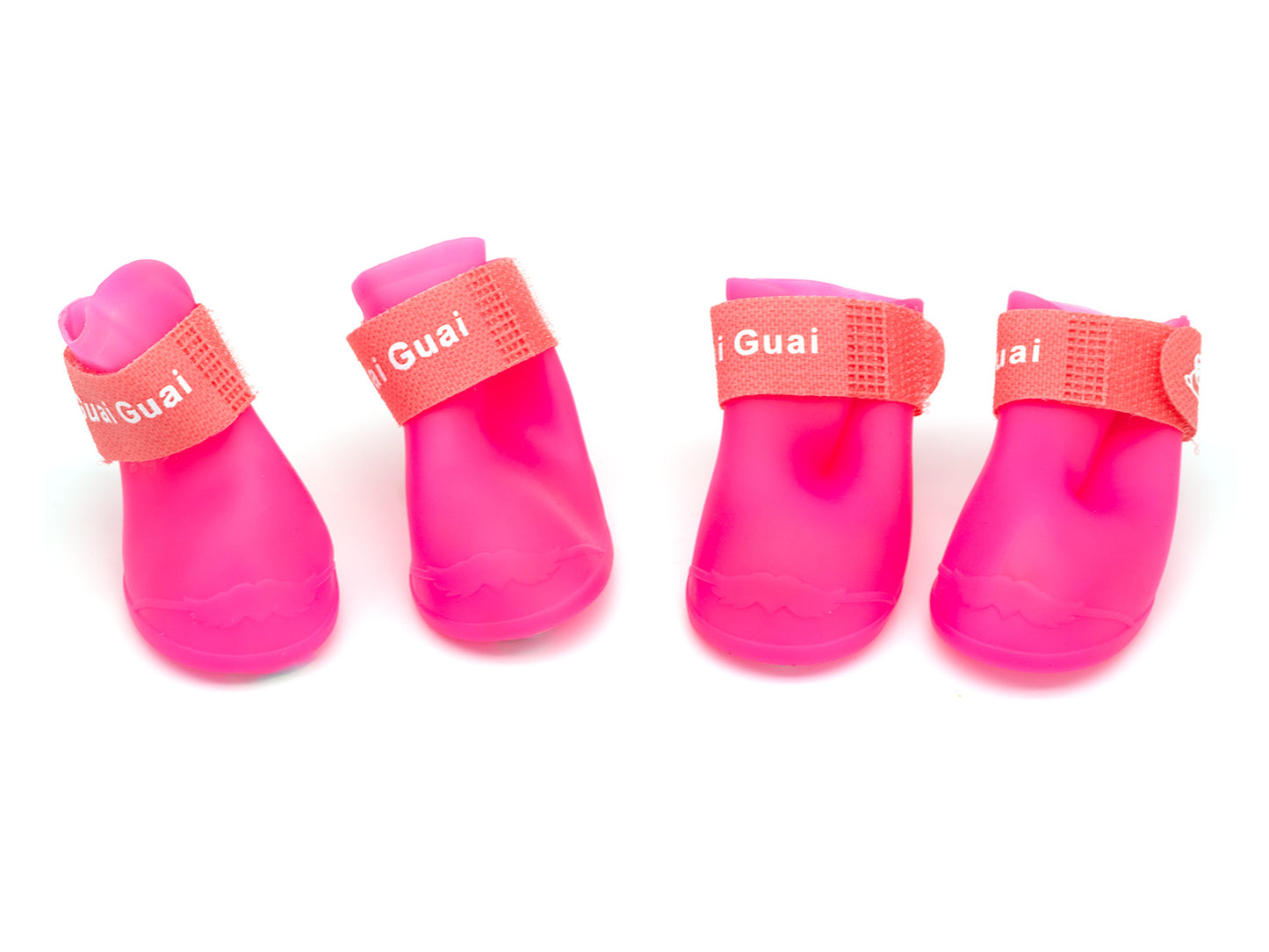 Four pink pet boots with coral bands on a white background