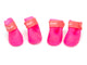 Four pink pet boots with coral bands on a white background