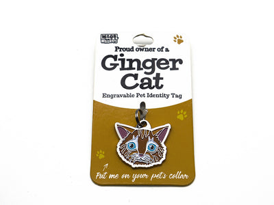 Engravable pet identity tag for Ginger Cat on a brown card with Wag & Whistle branding.