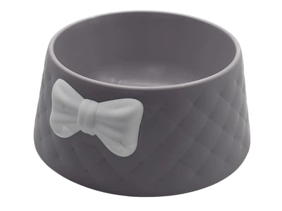 Gray pet bowl with a bow design on a white background