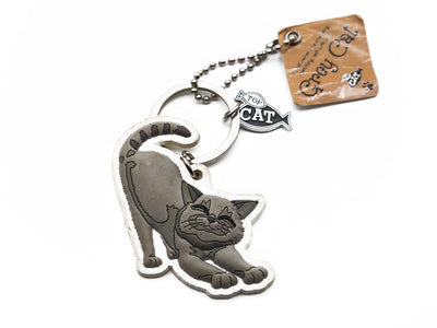 Cat-shaped keychain with a tag on a white background