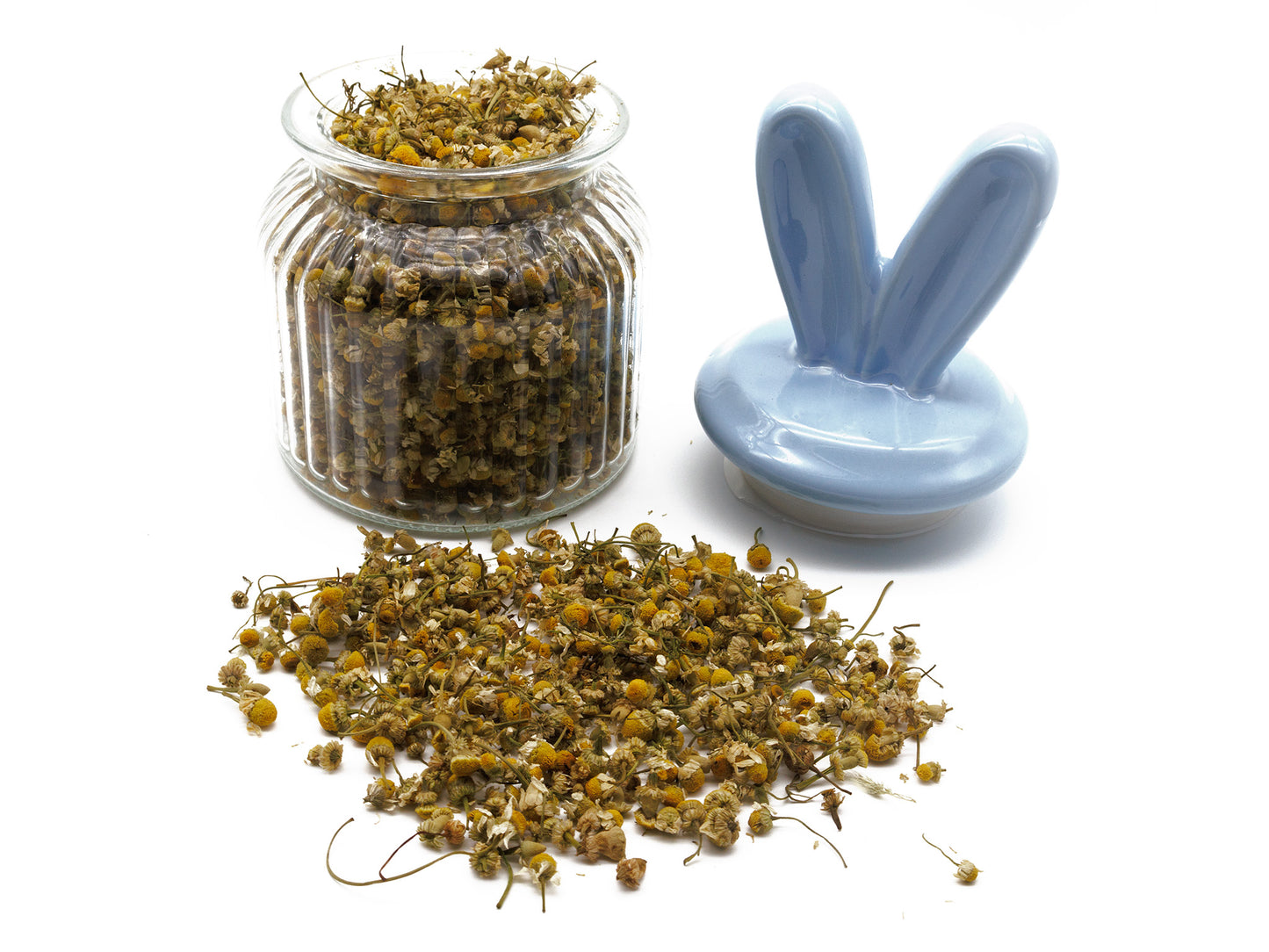 A jar filled with chamomile flowers