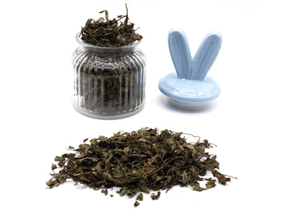 A jar filled with peppermint leaves