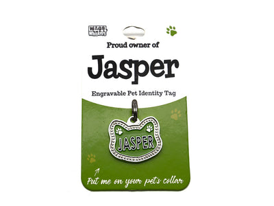 Engravable pet identity tag for Jasper on a green card with Wag Whiskers branding.