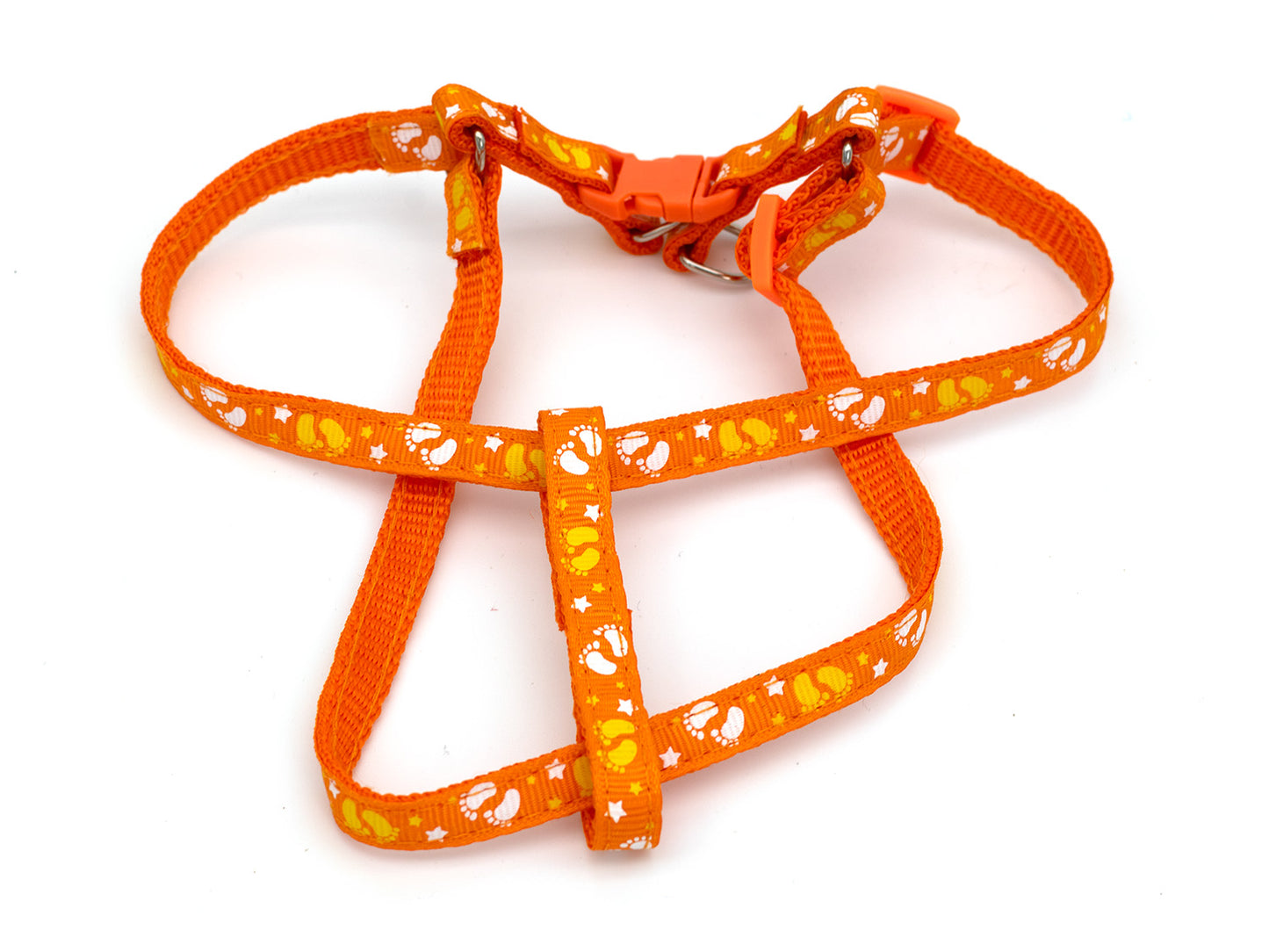 Orange dog harness with white paw print pattern on a white background