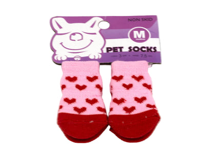 Pink pet socks with red hearts on a purple packaging label