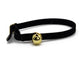 A black velvet choker collar with a small gold bell and gold metal buckle, shown on a plain white background.
