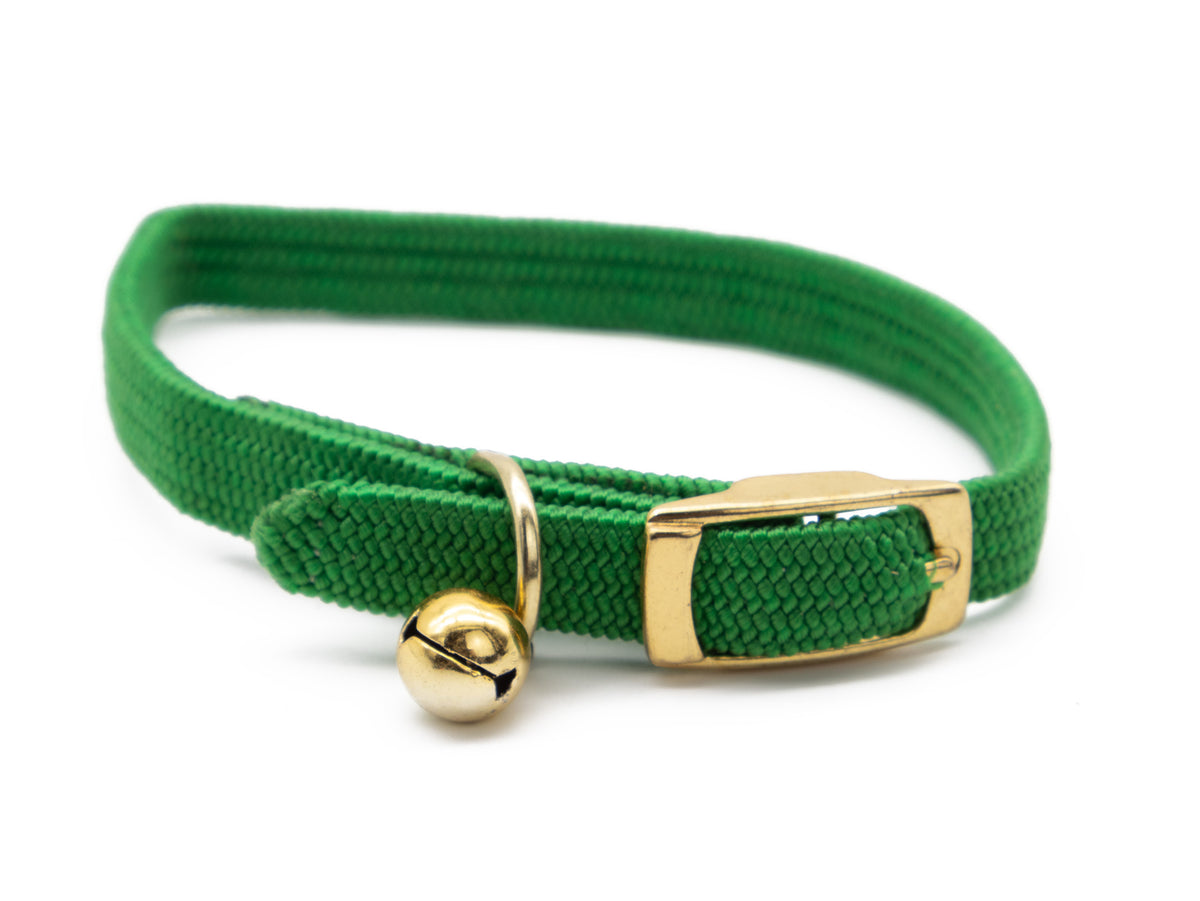 Green elastic cat safety collar with gold-tone buckle and bell, shown on a white background