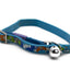 A blue pet collar with a colorful fish and sea creature pattern, featuring a silver metal buckle and a silver bell.