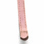 A close-up of a light pink leather strap, likely a watch band or belt, showing the stitched edge and a dark brown tip, set against a plain white background.