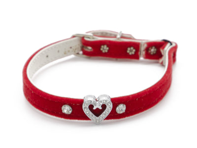 A red velvet pet collar with a silver-tone heart-shaped crystal charm in the center, accented with small crystal studs and silver-tone hardware, shown on a white background.