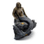Mermaid figurine sitting on a rock with starfish, on a white background