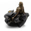 Bronze mermaid figurine sitting on a rock with a starfish, on a white background