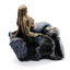 Decorative figurine of a mermaid on a rocky base with a white background