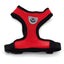 Red dog harness with black trim on a white background
