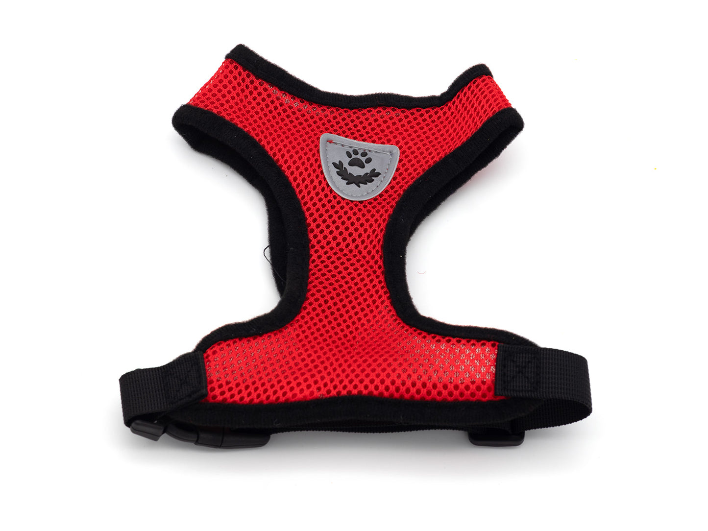 Red dog harness with black trim on a white background