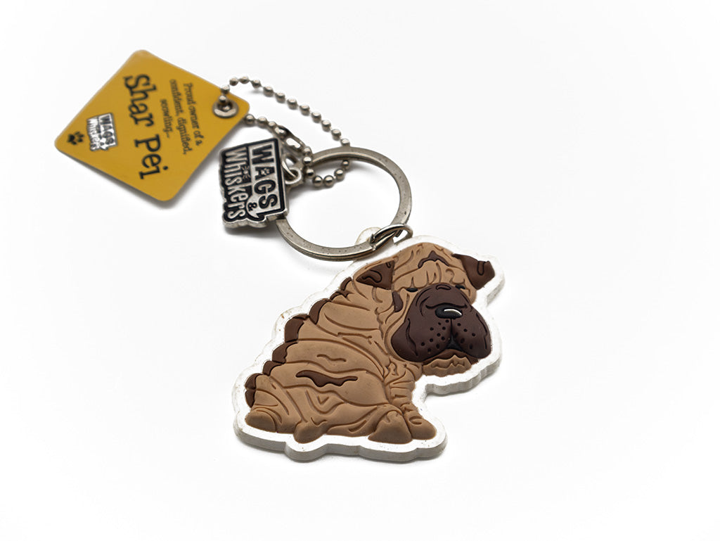Keychain shaped like a Shar Pei dog with a tag on a white background