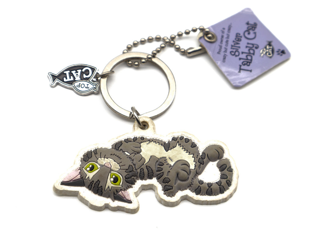 Keychain shaped like a cat with a tag on a white background