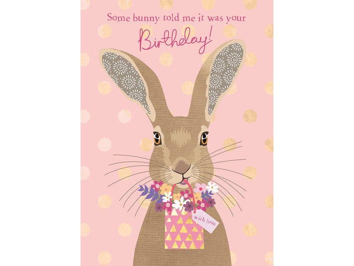 Birthday card with a rabbit holding flowers on a pink background