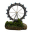 Ferris wheel model on a base with greenery against a white background
