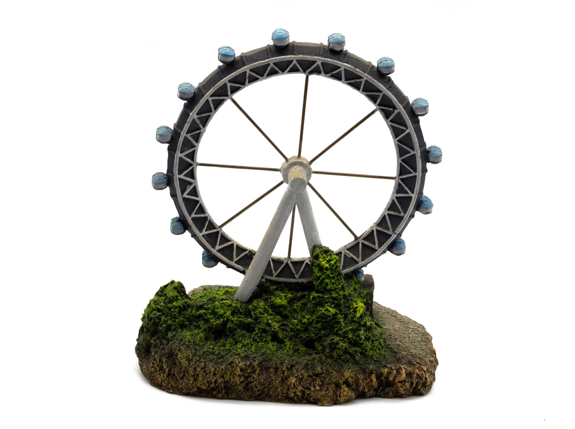 Ferris wheel model on a base with greenery against a white background