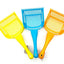 Three plastic litter scoops in yellow, blue, and orange, arranged side by side on a plain white background.